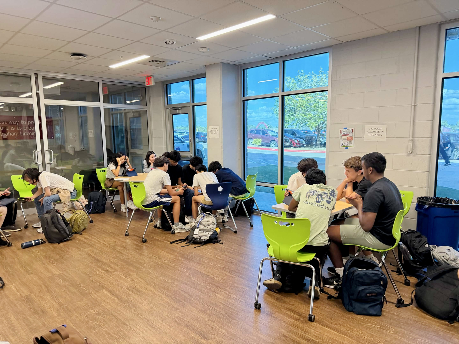En4AC members working in small groups during a club meeting